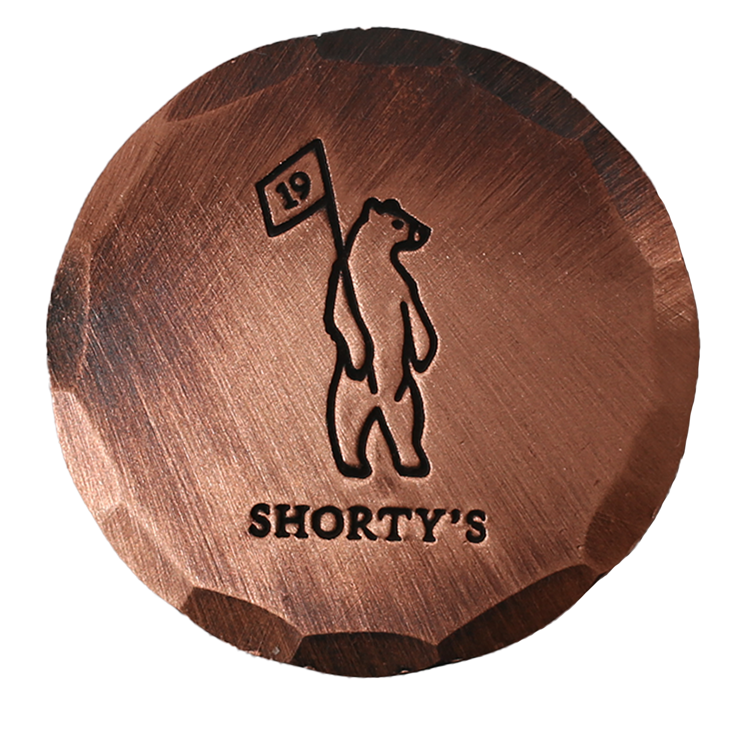 Copper golf ball mark with embossed Shorty's logo.