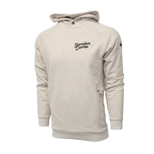 Tan hoodie features: Bandon Dunes across the right chest and the puffin logo on the left sleeve