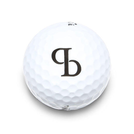A white golf ball with the Punch Bowl logo printed on it.