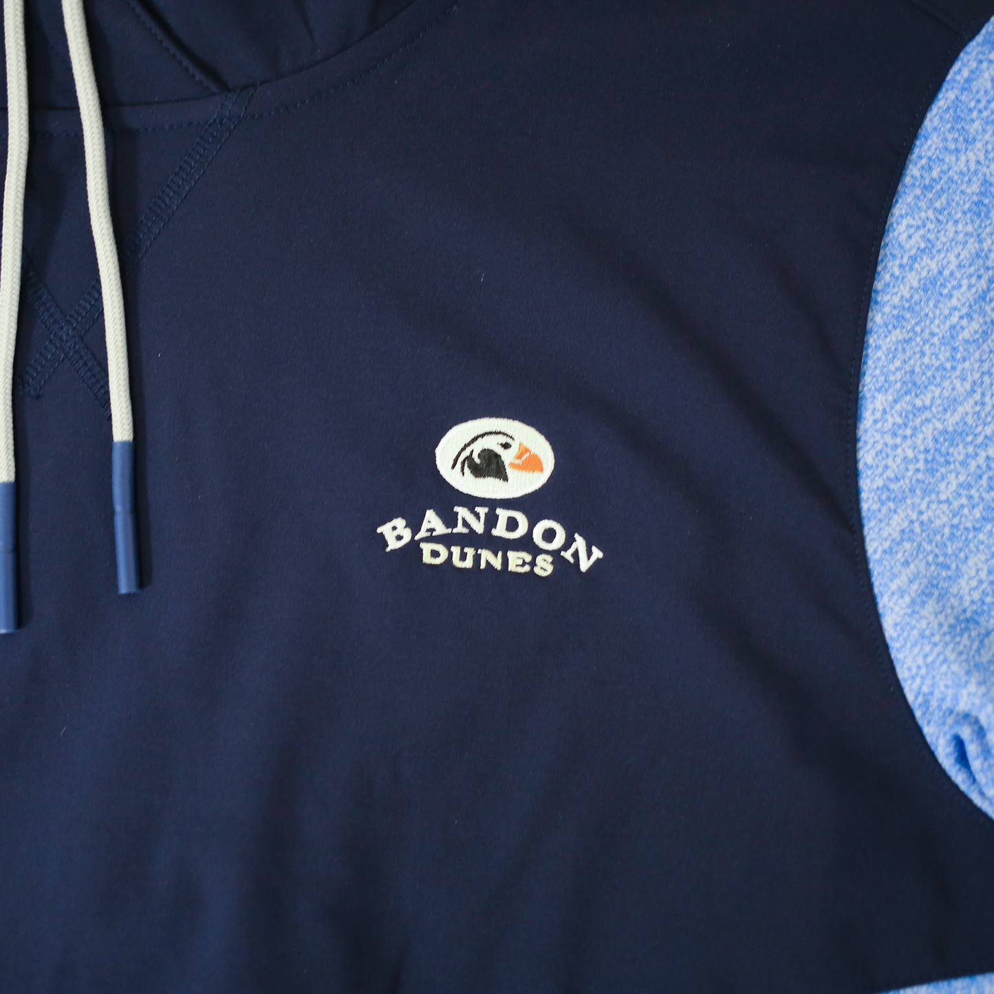 Close up of embroidered with the Bandon Dunes logo on navy fabric.
