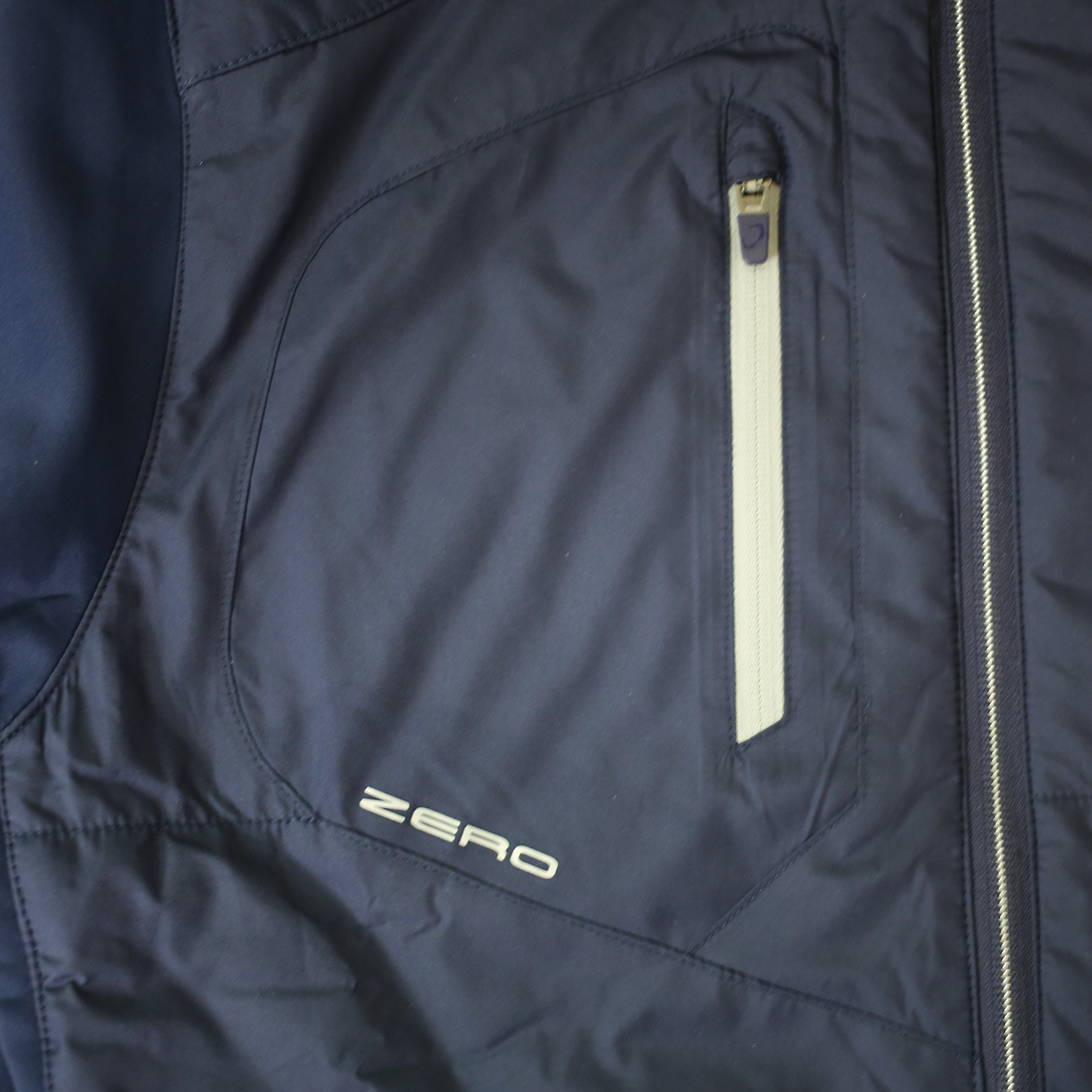 Clos up of chest pocket with Zero logo.