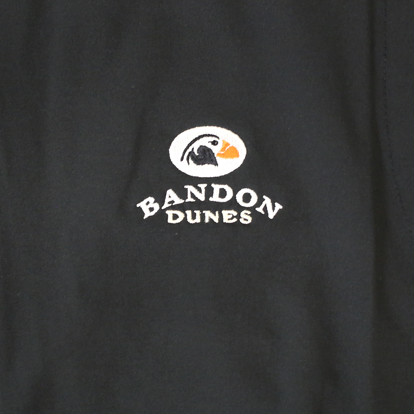 Close up of embroidered Bandon Dunes logo.