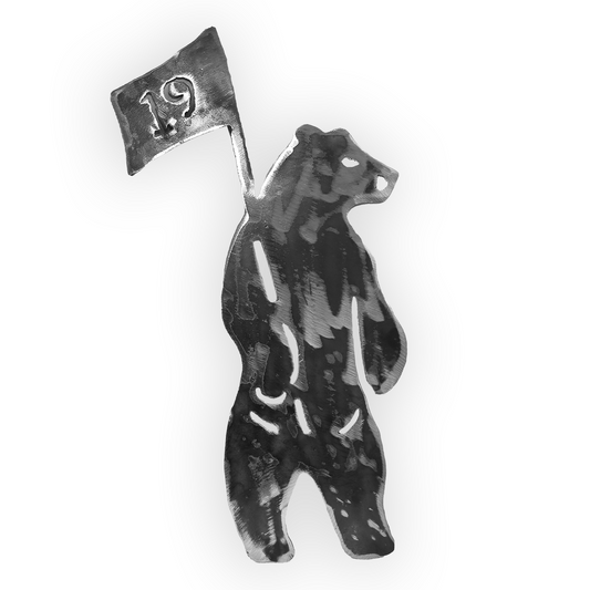 Cut forged iron shaped as the Shorty's bear logo.