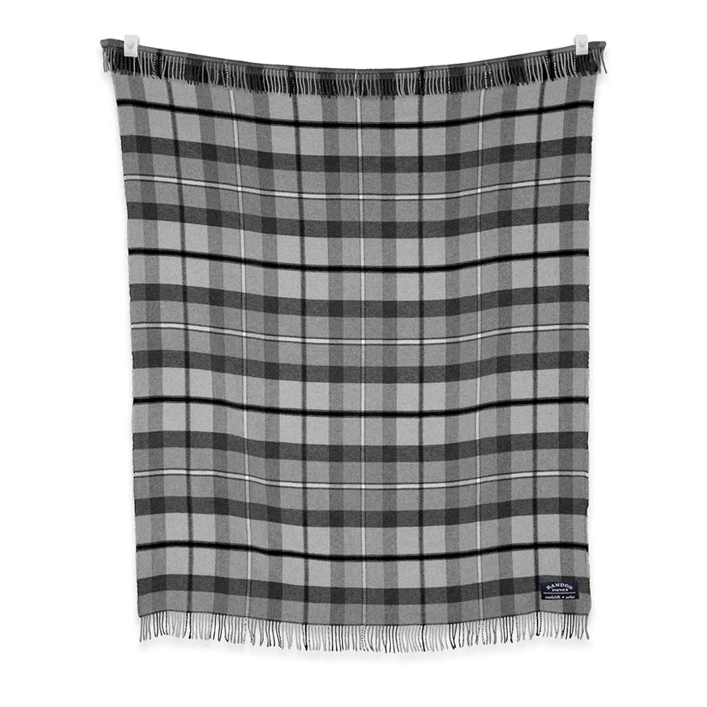 Blanket with gray, charcoal and black plaid design 