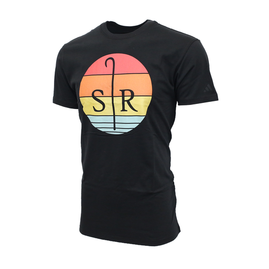 A black Adidas crew-neck t-shirt featuring a large circular graphic on the center chest. The graphic depicts a Sheep Ranch logo silhouetted in sunset composed of horizontal bands in red, orange, yellow, and light blue.